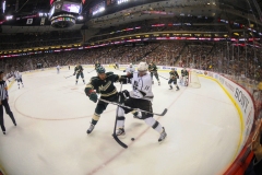 March 30 2013: Minnesota Wild defenseman Clayton Stoner battles for the puck in the corner
with Los Angeles Kings center Anze Kopitar
in the second period at the Xcel Energy Center in St. Paul, Minn. The Wild beat the Kings, 4-3, in an overtime shootout.