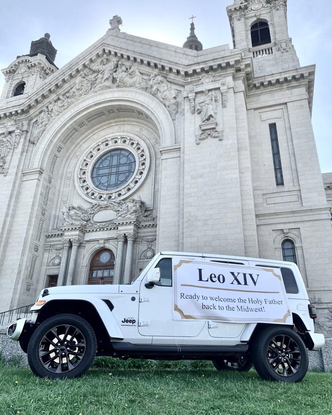 The Cathedral of Saint Paul greeted the news of the first American pope with this display. A local car dealership, #furymotors, volunteered this Jeep for the pope's use should the pontiff ever come to the Twin Cities. #pope #popeleo14 #catholicchurch #catholic