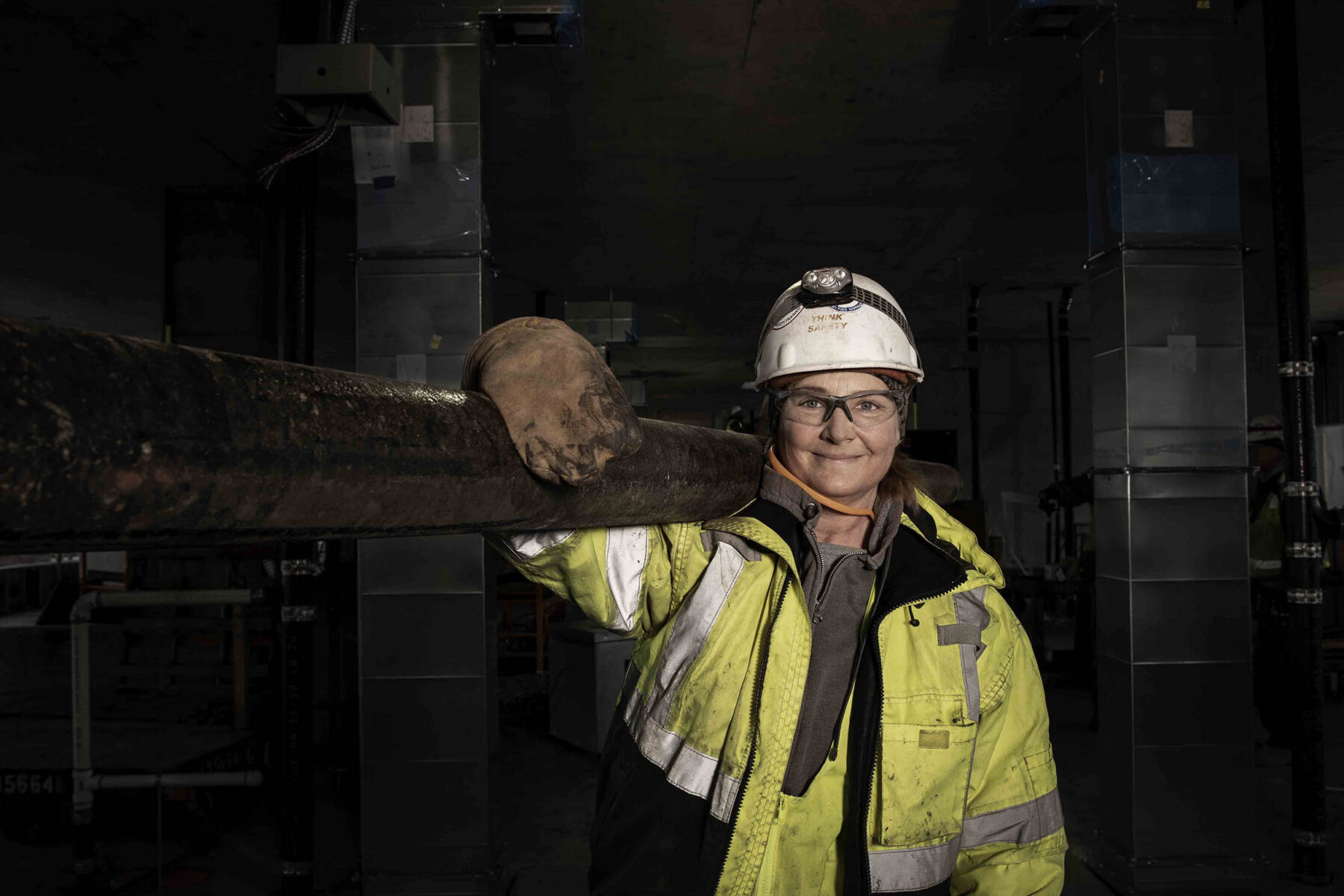 Woman plumber working on hotel job site