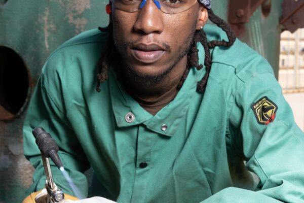 Afro American boilermaker welding