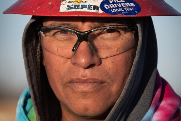 Hispanic union carpenter in cold weather
