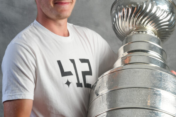 Pittsburgh Penguins Jake Guentzel holding Stanley Cup